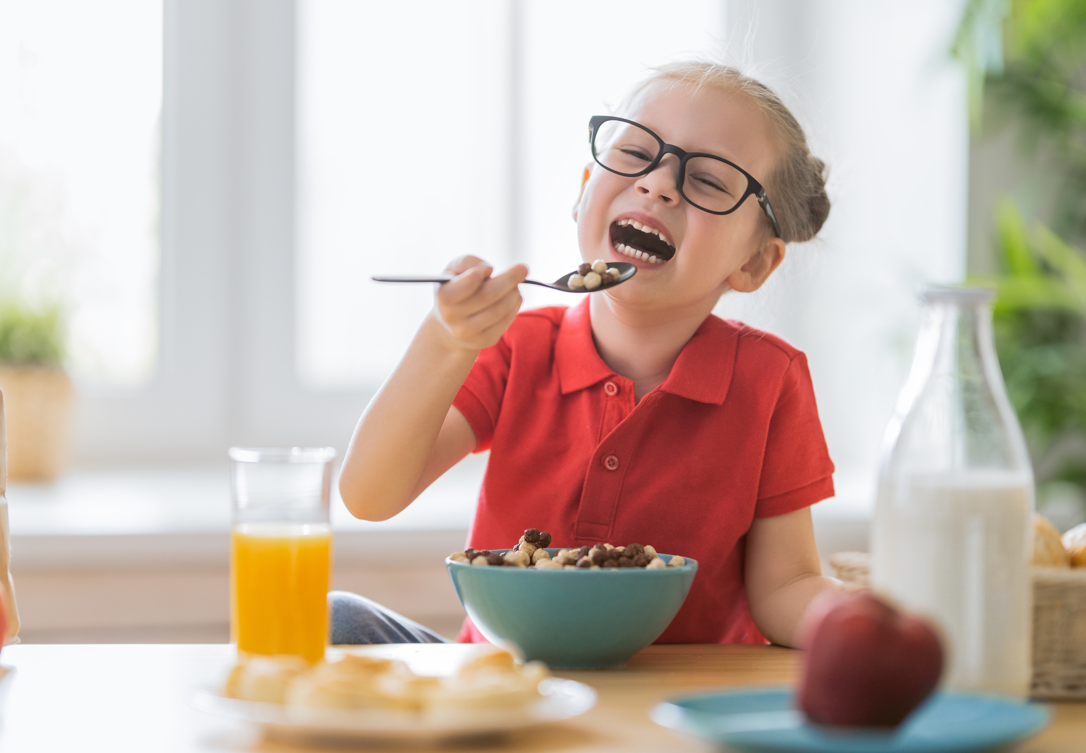 Happy Child Having Breakfast